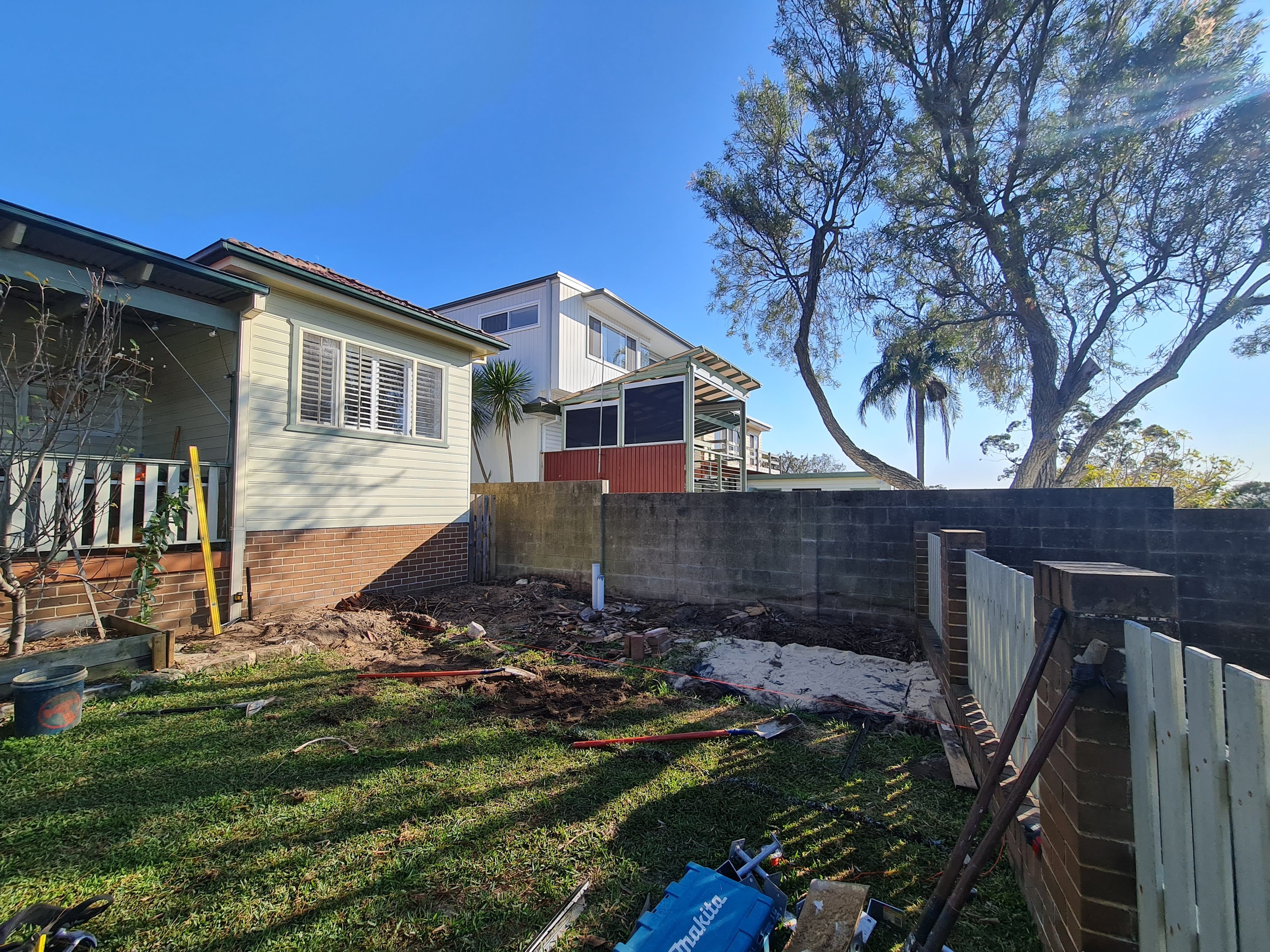 Jannali backyard before renovation — overgrown deteriorating yard