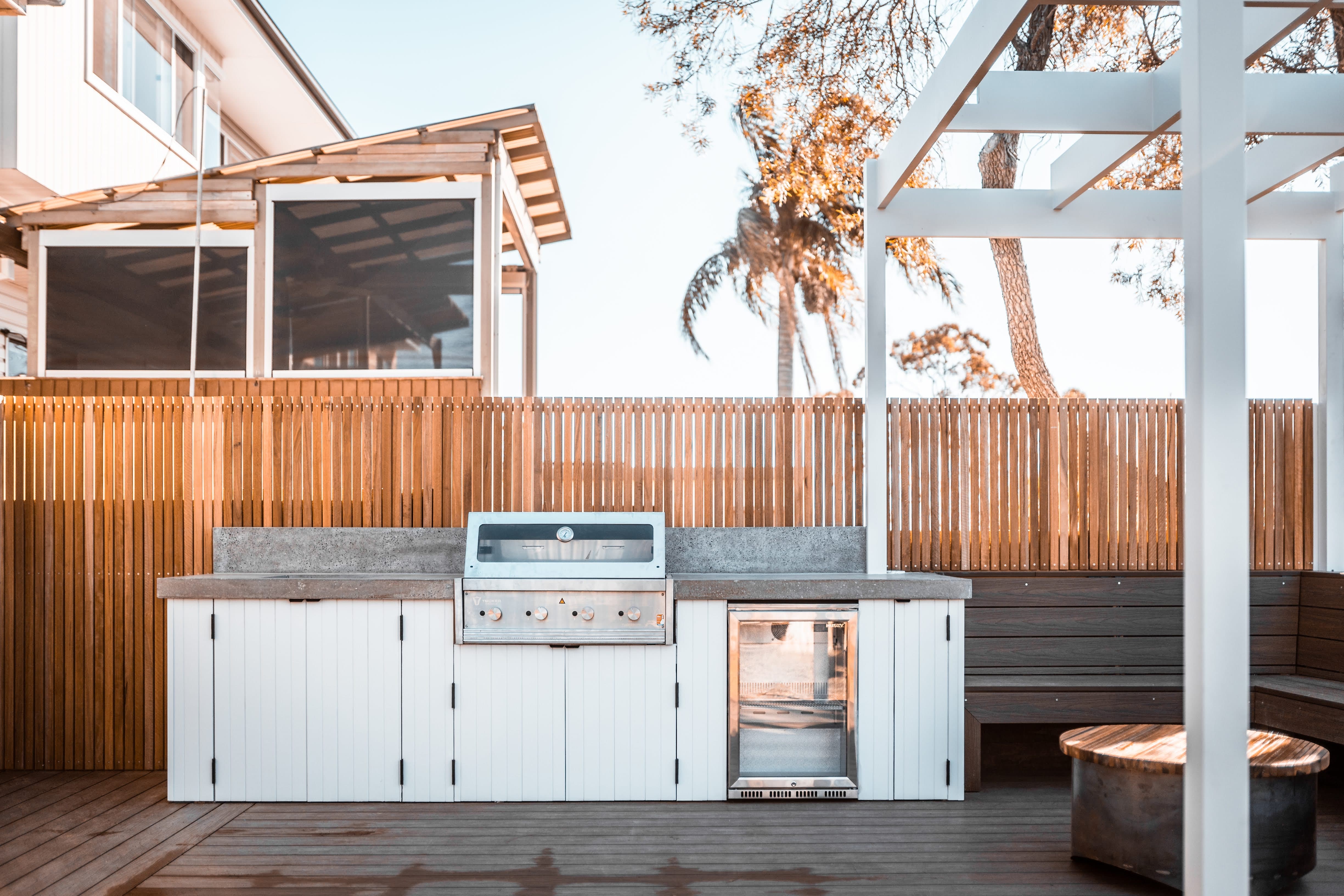 Jannali backyard after renovation — outdoor kitchen deck pergola by VIKING Design Build