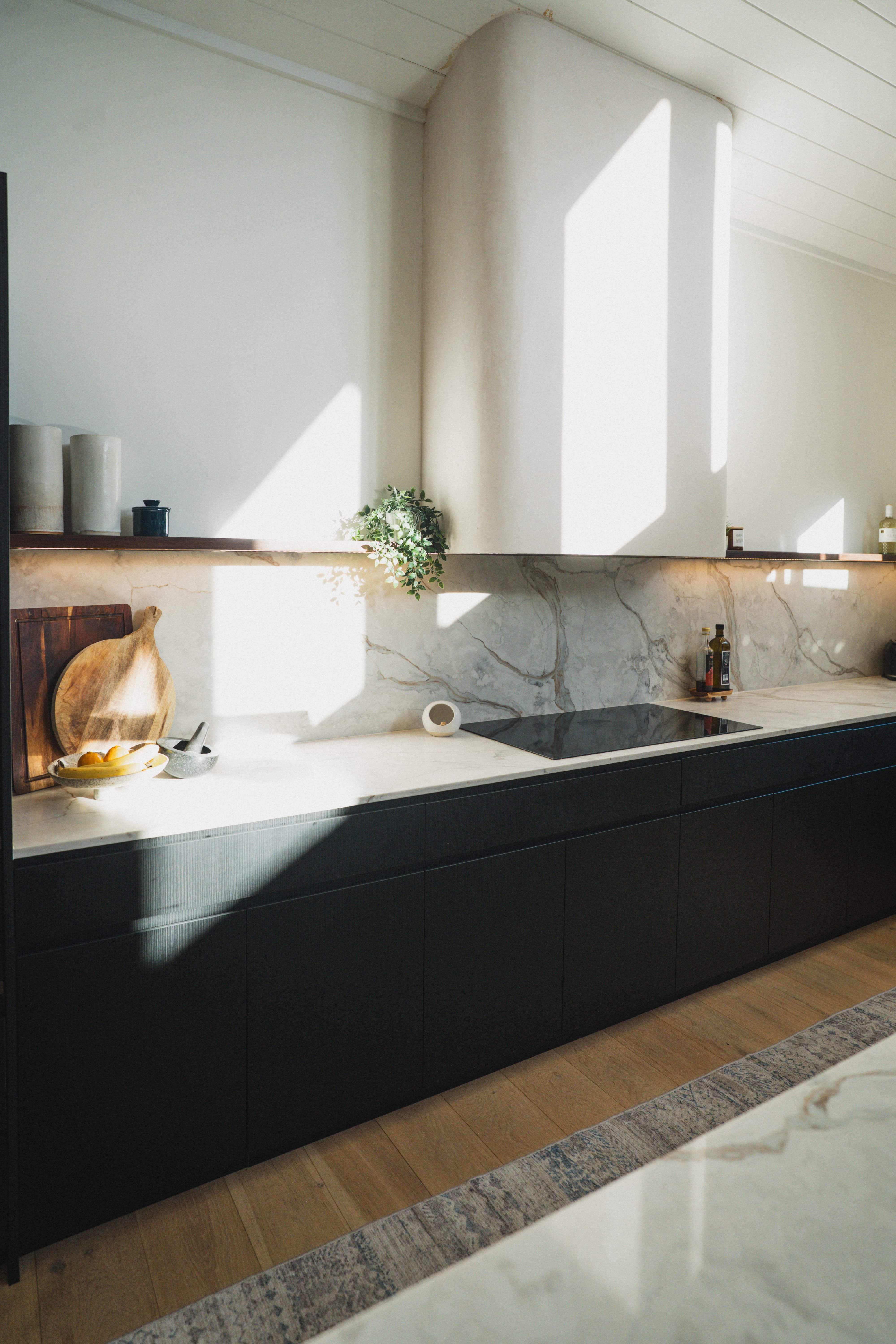Tarrawanna kitchen — marble splashback and matte black cabinetry