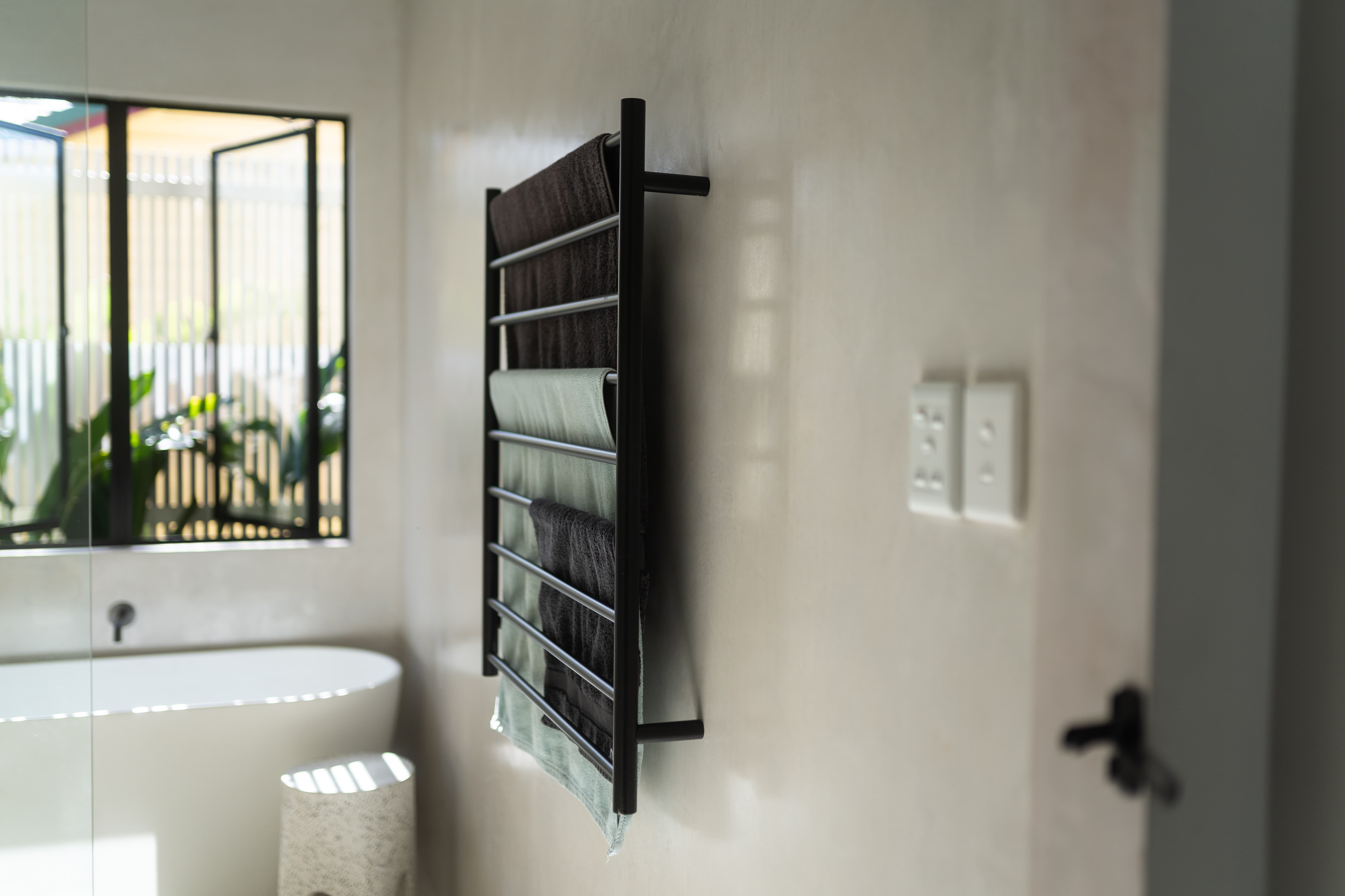 Heated towel rail microcement bathroom renovation Illawarra